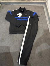 tuta conpleta lacoste nera e